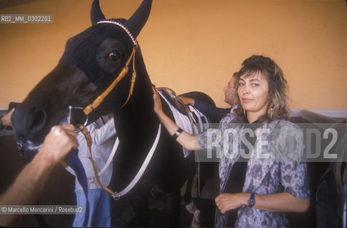 Rome, Capannelle Hippodrome, about 1988. Mafalda Ostamus, the first Italian horse trainer / Roma, Ippodromo Le Capannelle, 1988 circa. Mafalda Ostamus, la prima allenatrice di cavalli italiana - ©Marcello Mencarini/Rosebud2