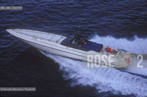 Operation of Italian Revenue Guard Corps against cigarette smuggling. Smugglers speedboat stalked by a helicopter / Operazione della guardia di Finanza contro il contrabbando di sigarette. Motoscafo dei contrabbandieri inseguito dallelicottero - ©Marcello Mencarini/Rosebud2
