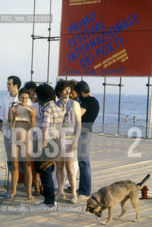 Castelporziano beach, Ostia (Rome), 1979. Naked woman reading during the First Festival of the Poets / Spiaggia di Castel Porziano, Ostia (Roma), 1979. Donna nuda che legge al primo Festival dei poeti - ©Marcello Mencarini/Rosebud2