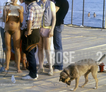 Castelporziano beach, Ostia (Rome), 1979. Nudists among the audience attending the First Festival of the Poets / Spiaggia di Castel Porziano, Ostia (Roma), 1979. Nudisti tra il pubblico che assiste al primo Festival dei poeti - ©Marcello Mencarini/Rosebud2