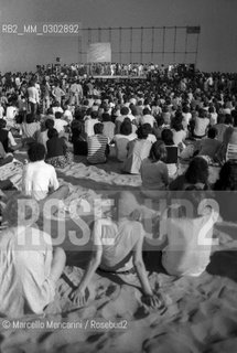Castelporziano beach, Ostia (Rome), 1979. Audience attending the First Festival of the Poets / Spiaggia di Castel Porziano, Ostia (Roma), 1979. Pubblico che assiste al primo Festival dei poeti - ©Marcello Mencarini/Rosebud2