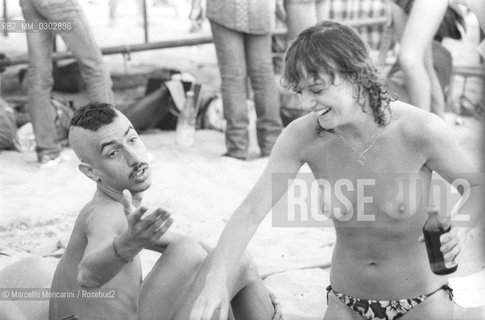 Castelporziano beach, Ostia (Rome), 1979. Nudists among the audience attending the First Festival of the Poets / Spiaggia di Castel Porziano, Ostia (Roma), 1979. Nudisti tra il pubblico che assiste al primo Festival dei poeti - ©Marcello Mencarini/Rosebud2
