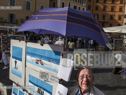 Rome, October 2012. Mirko, a painter of Piazza Navona,  where many painters expose and sell their works / Roma, ottobre 2012. Mirko, un pittore di piazza Navona, dove molti pittori espongono e vendono i loro lavori  - ©Marcello Mencarini/Rosebud2