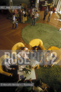 Venice Lido, Venice Film Festival about 1985. Giornalisti nella hall dellHotel Excelsior / Lido di Venezia, Mostra del Cinema di Venezia 1985 circa. Journalists in the lobby of the Excelsior Hotel- ©Marcello Mencarini/Rosebud2