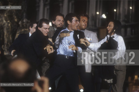 Venice, Saint Marks Square, final evening of the Venice Film Festival 1991. Marco Appignani, aka Cavallo Pazzo (Crazy Horse, bursts on stage / Venezia, piazza San Marco, serata finale della Mostra del Cinema di Venezia 1991. Marco Appignani, detto Cavallo Pazzo, irrompe sul palco - ©Marcello Mencarini/Rosebud2