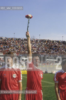 Italian National Singers Football Team, 1987. Singer Riccardo Fogli on the game field / Nazionale italiana cantanti 1987. Il cantante Riccardo Fogli in campo - ©Marcello Mencarini/Rosebud2