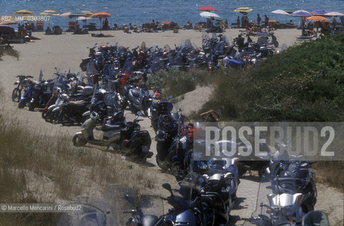 Ostia Lido (Rome), Castelporziano free beach (also known as i cancelli, in english: the gates), 1999. Motorbike parking near the seaside / Lido di Ostia (Roma), spiaggia libera di Castelporziano (detta i cancelli), 1999. Parcheggio di motorini sulla spiaggia  - ©Marcello Mencarini/Rosebud2