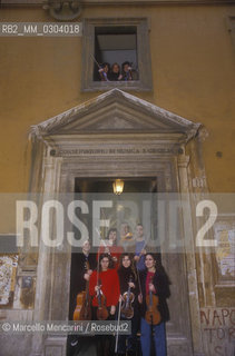Rome, about 1980. Students in front of the Conservatory of Santa Cecilia at via dei Greci / Roma, 1980 circa. Studenti davanti al Conservatorio Santa Cecilia - ©Marcello Mencarini/Rosebud2