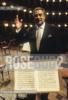 Rome Opera House, January 2000. Spanish tenor and conductor Placido Domingo poses during a rehearsal of Tosca conducted by himself and performed on occasion of its centenary in the same theater of its debut (directed by Franco Zeffirelli, conducted by Placido Domingo, starring Ines Salazar and Luciano Pavarotti) / Teatro dellOpera di Roma, gennaio 2000. Il tenore e direttore dorchestra Placido Domingo posa durante le prove di Tosca, diretta da lui stesso in occasione dei cento anni dal debutto di questopera (regia: Franco Zeffirelli, direttore dorchestra: Placido Domingo, protagonisti: Ines Salazar e Luciano Pavarotti) - ©Marcello Mencarini/Rosebud2