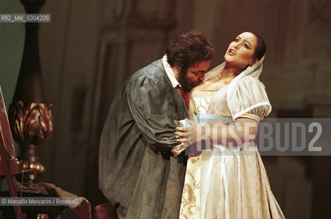 Rome Opera House, January 12, 2000. Tenor Luciano Pavarotti and soprano ines Salazar in Tosca by Giacomo Puccini, performed on occasion of its centenary in the same theater of its debut (directed by Franco Zeffirelli, conducted by Placido Domingo, starring Ines Salazar and Luciano Pavarotti) / Roma, Teatro dellOpera, 12 gennaio 2000. Il tenore Luciano Pavarotti e il soprano Ines Salazar in Tosca di Giacomo Puccini, rappresentata cento anni dopo nello stesso teatro del suo debutto (regia: Franco Zeffirelli, direttore dorchestra: Placido Domingo, protagonisti: Ines Salazar e Luciano Pavarotti) - ©Marcello Mencarini/Rosebud2