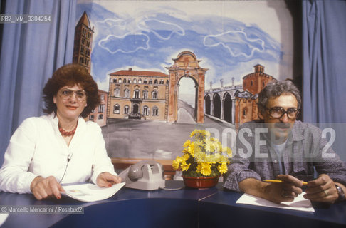Biella, about 1980. Telebiella, the first private tv station in Italy to break the monopoly of RAI Italian public television. Founder of Telebiella Giuseppe Sacchi and his wife Ivana Ramella in studio performing in a program / Biella 1980 circa. Telebiella, la prima televisione privata in Italia a rompere il monopolio della RAI: Il fondatore di Telebiella Giuseppe Sacchi e sua moglie Ivana Ramella al lavoro in studio durante un programma - ©Marcello Mencarini/Rosebud2