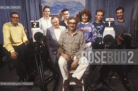 Biella, about 1980. Telebiella, the first private tv station in Italy to break the monopoly of RAI Italian public television. Founder of Telebiella Giuseppe Sacchi (in the middle) and his wife Ivana Ramella posing with their staff in the TV studio / Biella 1980 circa. Telebiella, la prima televisione privata in Italia a rompere il monopolio della RAI: Il fondatore di Telebiella Giuseppe Sacchi (al centro) e sua moglie Ivana Ramella in posa con il loro staff nello studio televisivo - ©Marcello Mencarini/Rosebud2