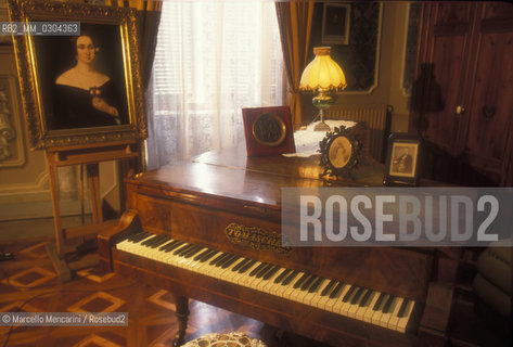 House Barezzi in Busseto (Parma), seat of Busseto Filarmonica founded in 1816 by Antonio Barezzi and maestro Ferdinando Provesi. .Antonio Barezzi was patron and father in law of composer Giuseppe Verdi, that here met his first wife, Barezzis daughter Margherita. In the background, a portrait of Giuseppina Strepponi, second wife of Verdi / Casa Barezzi a Busseto (Parma), sede della Filarmonica di Busseto fondata da Antonio Barezzi e dal maestro Ferdinando Provesi. Antonio Barezzi fu mecenate e suocero del compositore Giuseppe Verdi, che qui conobbe la sua prima moglie Margherita Barezzi, figlia di Antonio, Sullo sfondo, un ritratto della sua seconda moglie Giuseppina Strepponi - ©Marcello Mencarini/Rosebud2