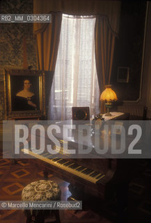 House Barezzi in Busseto (Parma), seat of Busseto Filarmonica founded in 1816 by Antonio Barezzi and maestro Ferdinando Provesi. .Antonio Barezzi was patron and father in law of composer Giuseppe Verdi, that here met his first wife, Barezzis daughter Margherita. In the background, a portrait of Giuseppina Strepponi, second wife of Verdi / Casa Barezzi a Busseto (Parma), sede della Filarmonica di Busseto fondata da Antonio Barezzi e dal maestro Ferdinando Provesi. Antonio Barezzi fu mecenate e suocero del compositore Giuseppe Verdi, che qui conobbe la sua prima moglie Margherita Barezzi, figlia di Antonio, Sullo sfondo, un ritratto della sua seconda moglie Giuseppina Strepponi - ©Marcello Mencarini/Rosebud2