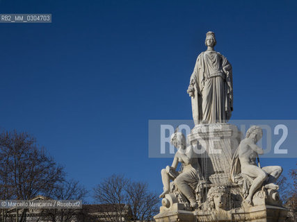 Nîmes, France. The main statue of the Pradier Fountain (Fontaine Pradier, 1851), that represents the city of Nimes in the form of woman. The four statues at its base represent the four main sources of water in the region: the headwaters of Nîmes, the Gardon River, the headwaters of the Eure, the river Rhone / Nîmes, Francia. La statua principale della Fontana Pradier (1851), che rappresenta la città di Nîmes in forma di donna. Le quattro statue aila sua base rappresentano le quattro principali fonti dacqua della regione: le sorgenti di Nîmes,il fiume Gardon, le sorgenti dellEure, il fiume Rodano - ©Marcello Mencarini/Rosebud2