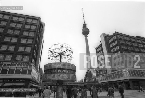 East Berlin, 1989. The universal clock with the solar system installed in 1969 in Alexanderplatz and the TV Tower / Berlino Est, 1989. Lorologio universale con il sistema solare installato nel 1969 in Alexanderplatz e  la Torre della televisione- ©Marcello Mencarini/Rosebud2