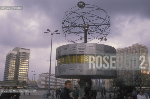 East Berlin, 1989. The universal clock with the solar system installed in 1969 in Alexanderplatz / Berlino Est, 1989. Lorologio universale con il sistema solare installato nel 1969 in Alexanderplatz - ©Marcello Mencarini/Rosebud2