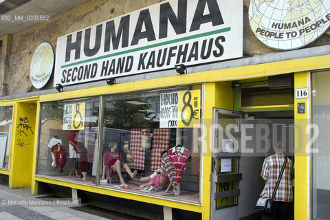 Berlin, 2005. A Humana store in Berlin. Humana People to People is a movement engaged in charitable activities who works with the collection, sorting and sales of second hand clothes - ©Marcello Mencarini/Rosebud2