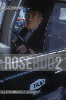 LISBON, 1989. The citys oldest taxi driven by his owner Augustus / LISBONA, 1989. Il taxi più vecchio della città guidato da Augusto, suo primo proprietario - ©Marcello Mencarini/Rosebud2