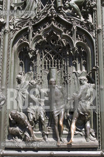 Panel of the main bronze door of the Duomo di Milano designed by Lodovico Pogliaghi: The Flagellation of Christ, located on the left shutter, it is part of the series of Virgin Marys Pains / Formella in bronzo della Porta maggiore del Duomo di Milano ideata da Lodovico Pogliaghi: la flagellazione di Cristo, posta sul battente di sinistra, fa parte della serie dei Dolori della Vergine Maria - ©Marcello Mencarini/Rosebud2