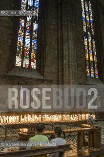Votive candles in the Milan Cathedral / Candele votive nel Duomo di Milano - ©Marcello Mencarini/Rosebud2