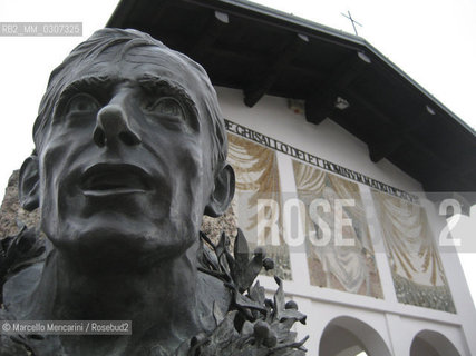 Ghisallo Pass near Bellagio (Como); 2008. Statue of Fausto Coppi in the square of the Madonna del Ghisallo Church; the patron saint of cyclists, where are preserved jerseys and bikes of the main champions / Valico del Ghisallo vicino a Bellagio (Como); 2008. Statua di Fausto Coppi nel piazzale della Chiesa della Madonna del Ghisallo; protettrice dei ciclisti; al cui interno sono conservate maglie e biciclette dei principali campioni - ©Marcello Mencarini/Rosebud2