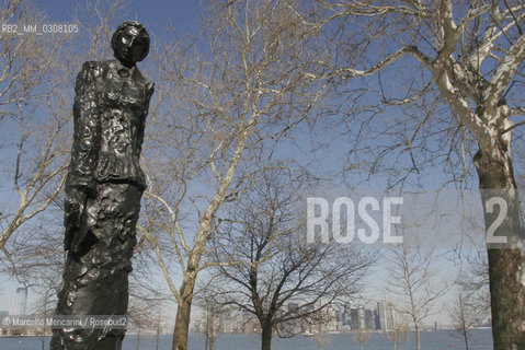 New York City, 2008. The five founders of the Statue of Liberty: 5 - Statue of Emma Lazarus by Phillip Ratner on Liberty Island. Emma Lazarus (July 22, 1849 – November 19, 1887) was an American poet born in New York City. She is best known for writing The New Colossus, a sonnet written in 1883, that is now engraved on a bronze plaque on a wall in the base of the Statue of Liberty. The sonnet was solicited by William Maxwell Evarts as a donation to an auction, conducted by the Art Loan Fund Exhibition in Aid of the Bartholdi Pedestal Fund for the Statue of Liberty to raise funds to build the pedestal. / New York, 2008. I cinque artefici della Statua della Libertà: 5 - Emma Lazarus in una scultura in bronzo opera di Phillip Ratner a Liberty Island, La poetessa newyorchese Emma Lazarus è lautrice del sonetto The new Colossus composto nel 1883 per stimolare la raccolta di fondi necessari al completamento del piedistallo della Statua della Libertà. Questo sonetto è stato poi inciso in una placca di bronzo sulla base della statua ©Marcello Mencarini/Rosebud2