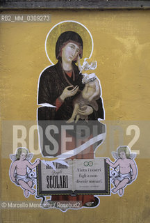 Rome, Graffiti collage on a wall: Holy Virgin of schoolchildren help us not to let our children become jackasses / Roma, Graffiti collage su un muro: Santa Vergine degli scolari aiutaci a non far divenire i nostri figli somari - ©Marcello Mencarini/Rosebud2