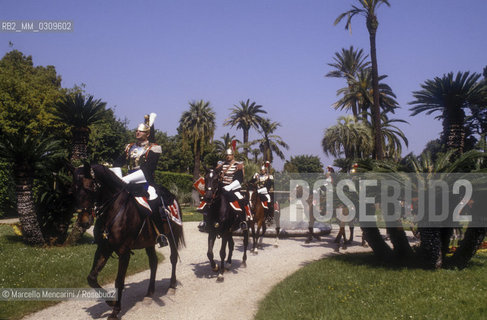 Rome, 1985. Cuirassier on horseback in the gardens of the Quirinale Palace, seat of the President of the Italian Republic, of which they are the honor guard / Roma, 1985. Corazzieri a cavallo nei giardini del palazzo del Quirinale, sede del Presidente della Repubblica italiana di cui sono la guardia donore - ©Marcello Mencarini/Rosebud2
