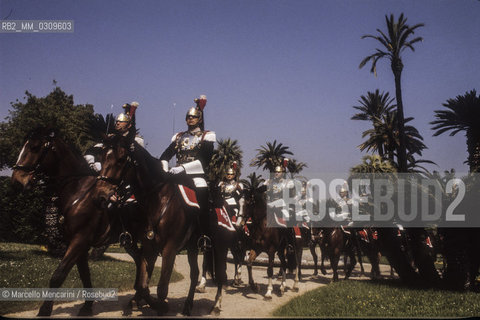 Rome, 1985. Cuirassier on horseback in the gardens of the Quirinale Palace, seat of the President of the Italian Republic, of which they are the honor guard / Roma, 1985. Corazzieri a cavallo nei giardini del palazzo del Quirinale, sede del Presidente della Repubblica italiana di cui sono la guardia donore - ©Marcello Mencarini/Rosebud2