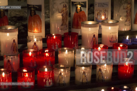 Votive candles dedicated to St. Sarah in the crypt of the Church of the Saintes Maries de la Mer in the Provence region, France. St. Sara is a major figure of the Gypsy cultural tradition / Candele votive dedicate a Santa Sara nella cripta della chiesa di Saintes Maries de la mer in Provenza, Francia - ©Marcello Mencarini/Rosebud2