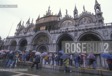 Venice, about 1990. Hig tide walkways in front of the St. Marks Basilica / Venezia, 1990 circa. Passerelle per lacqua alta davanti alla Basilica di San Marco - ©Marcello Mencarini/Rosebud2
