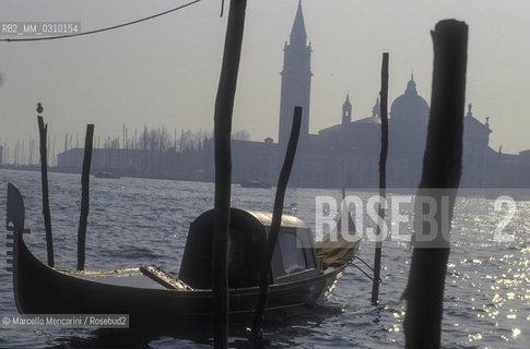 Venice, about 1990. Gondola with felze, a small cabin, to protect the passengers from the weather or from onlookers / Venezia, 1990 circa. Gondola con felze, una piccola cabina per proteggere i passeggeri dal maltempo e dagli sguardi - ©Marcello Mencarini/Rosebud2
