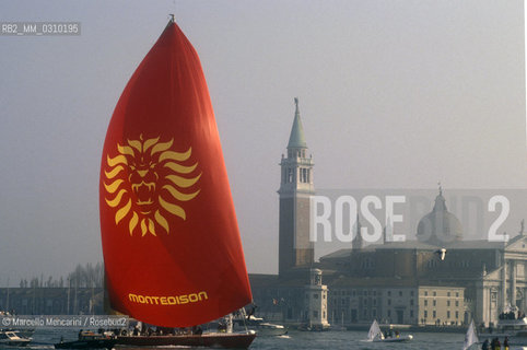 Venice, about 1992. Il Moro di Venezia, the International Americas Cup Class sailing boat built for the 1992 Italian team, in the St. Marks Basin in front of San Giorgio Island / Il Moro di Venezia, la barca a vela costruita per la squadra italiana dellAmericas Cup 1992, nel bacino di San Marco davanti allIsola di San Giorgio - ©Marcello Mencarini/Rosebud2