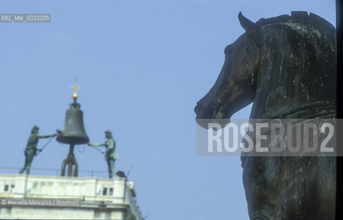 Venice, about 1990. The Clock Tower viewed from the Saint Marks Basilica / Venezia, 1990 circa. La torre dellorologio vista dalla basilica di San Marco - ©Marcello Mencarini/Rosebud2