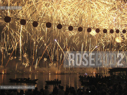 Venice, fireworks for the Feast of the Redeemer. This event celebrates every year the building by order of the Venetian Senate (in 1576) of the Church of the Redeemer as a votive offering for citys deliverance from the plague of 1575-1577 / Venezia, fuochi dartificio per la Festa del Redentore. Questo evento ricorda ogni anno la costruzione per ordine del Senato veneziano (nel 1576) della Chiesa del Redentore come ex voto per la liberazione della città dalla peste del 1575-1577 - ©Marcello Mencarini/Rosebud2
