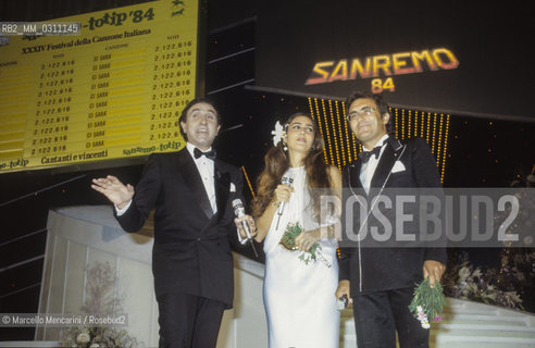 Sanremo Music Festival 1984. Tv presenter Pippo Baudo with pop singers Al Bano and Romina Power, winners with the song Ci sarà (in English: there will be) / Festival di Sanremo 1984. Il presentatore TV Pippo Baudo con i cantanti Al Bano e Romina Power, vincitori con la canzone Cisarà - ©Marcello Mencarini/Rosebud2