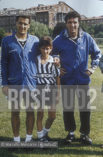 Stuttgart, 1990. Baby soccer Player Fabio Alderucci, bought by Italian soccer team Juventus, with Gaetano Scirea and Dino Zoff / Stoccarda, 1990. Il baby calciatore Fabio Alderucci, comprato dalla Juventus, con Gaetano Scirea e Dino Zoff - ©Marcello Mencarini/Rosebud2
