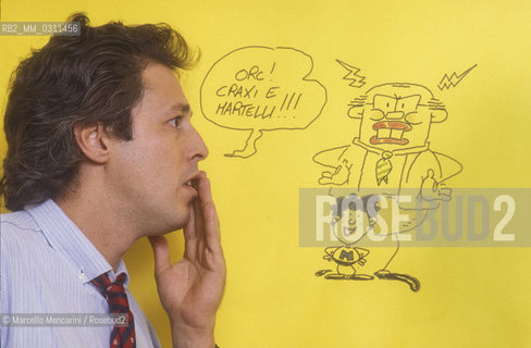 Lucca, 1984. Italian cortoonist Angese (pseudonym of Sergio Angeletti) posing next to one of his drawing / Lucca, 1984. il disegnatore di fumetti Angese (pseudonimo of Sergio Angeletti) posa accanto a un suo disegno - ©Marcello Mencarini/Rosebud2
