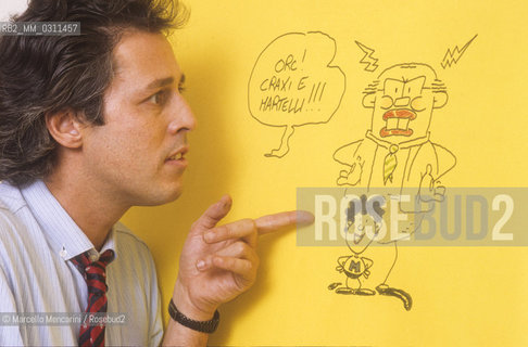 Lucca, 1984. Italian cortoonist Angese (pseudonym of Sergio Angeletti) posing next to one of his drawing / Lucca, 1984. il disegnatore di fumetti Angese (pseudonimo of Sergio Angeletti) posa accanto a un suo disegno - ©Marcello Mencarini/Rosebud2