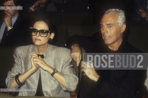 Milan, about 1985. Italian fashion designer Giorgio Armani and actress Claudia Cardinale / Milano, 1985 circa. Lo stilista Giorgio Armani e lattrice Claudia Cardinale - ©Marcello Mencarini/Rosebud2