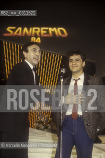 Sanremo Music Festival 1984. Italian TV presenter Pippo baudo and pop singer Marco Armani, second in the new proposals category with the song Solo con lanima mia / Festival di Sanremo, 1984. Il presentatore Pippo Baudo e il cantante Marco Armani, secondo classificato nella categoria Nuove proposte con la canzone Solo con lanima mia - ©Marcello Mencarini/Rosebud2