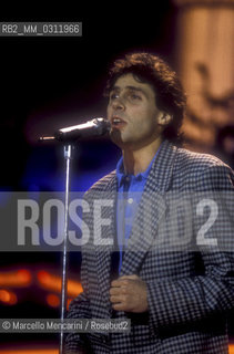 Sanremo Music Festival 1988. Luca Barbarossa performs his song Lamore rubato (ranked third) / Festival di Sanremo 1988. Il cantante Luca Barbarossa canta Lamore rubato (terza classificata) - ©Marcello Mencarini/Rosebud2