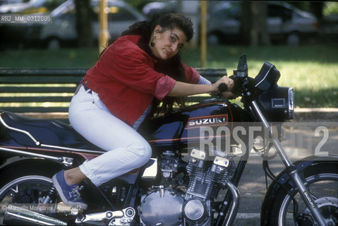 Rome, 1992. Opera singer Cecilia Bartoli on a motorcycle / Roma, 1992. La cantante lirica Cecilia Bartoli in moto - ©Marcello Mencarini/Rosebud2