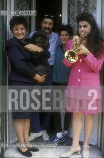 Rome, 1992. Opera singer Cecilia Bartoli with her family: her mother Silvana, her dog Figaro, her brother Gabriele and her sister Federica / Roma, 1992. La cantante lirica Cecilia Bartoli con la sua famiglia: la madre Silvana, il cane Figaro, il fratello Gabriele e la sorella Federica - ©Marcello Mencarini/Rosebud2