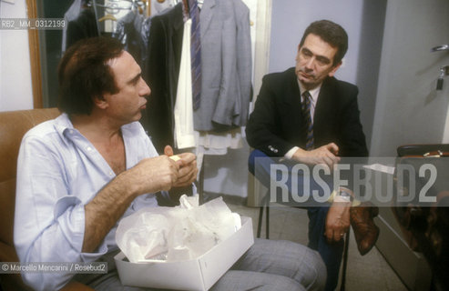 Sanremo Music Festival 1985. Italian TV presenter Pippo Baudo in his dressing room with Mario Maffucci, manager of RAI, the Italian public television / Festival di Sanremo 1985. Il presentatore TV Pippo Baudo nel suo camerino cpon il capostruttura RAI Mario Maffucci - ©Marcello Mencarini/Rosebud2
