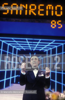 Sanremo Music Festival 1985. Italian TV presenter Pippo Baudo performing on stage / Festival di Sanremo 1985. Il presentatore TV Pippo Baudo sul palco del Teatro Ariston durante la diretta televisiva - ©Marcello Mencarini/Rosebud2