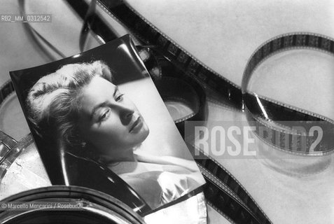 A photograph of the actress Ingrid Bergman among some celluloid strips / Una fotografia dellattrice Ingrid Bergman tra strisce di celluloide - ©Marcello Mencarini/Rosebud2