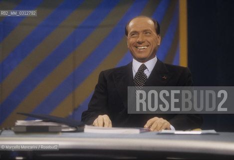 Rome, 1996. Politician Silvio Berlusconi takes part in the TV program Porta a Porta to present the electoral program of his party, the Polo delle Libertà (PDL) / Roma, 1996. Il politico Silvio Berlusconi interviene nel programma TV Porta a Porta per presentare il programma elettorale del suo partito, il Polo delle Libertà - ©Marcello Mencarini/Rosebud2