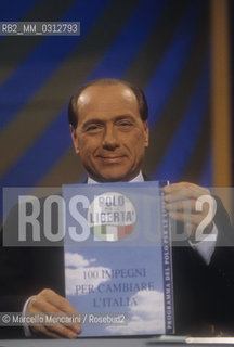 Rome, 1996. Politician Silvio Berlusconi takes part in the TV program Porta a Porta to present the electoral program of his party, the Polo delle Libertà (PDL) / Roma, 1996. Il politico Silvio Berlusconi interviene nel programma TV Porta a Porta per presentare il programma elettorale del suo partito, il Polo delle Libertà - ©Marcello Mencarini/Rosebud2